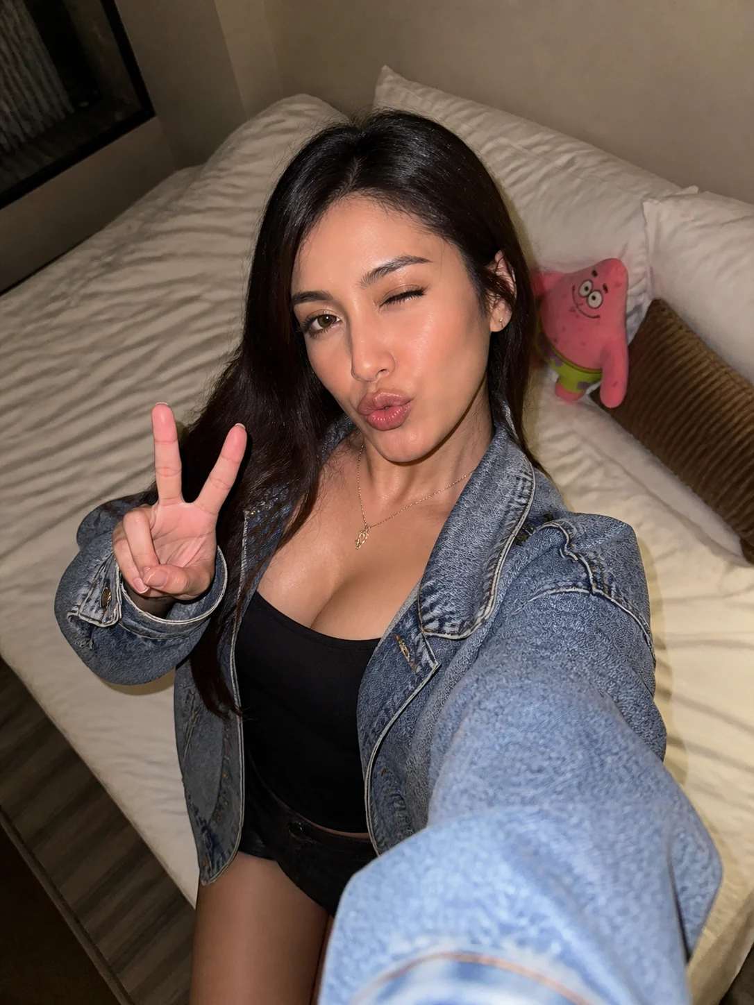Adult high-angle phone flash bed selfie sample