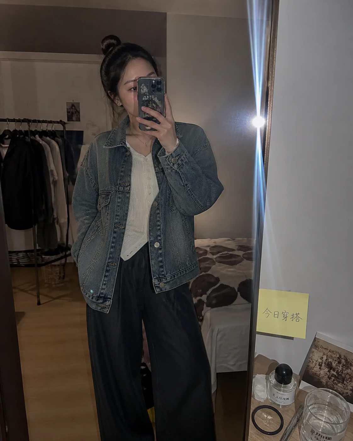 Adult mirror selfie with jacket and phone flash